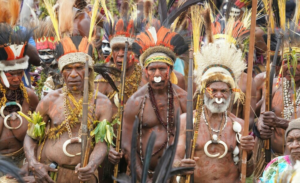 Papua New Guinea highlands men dressing in their traditional attires.