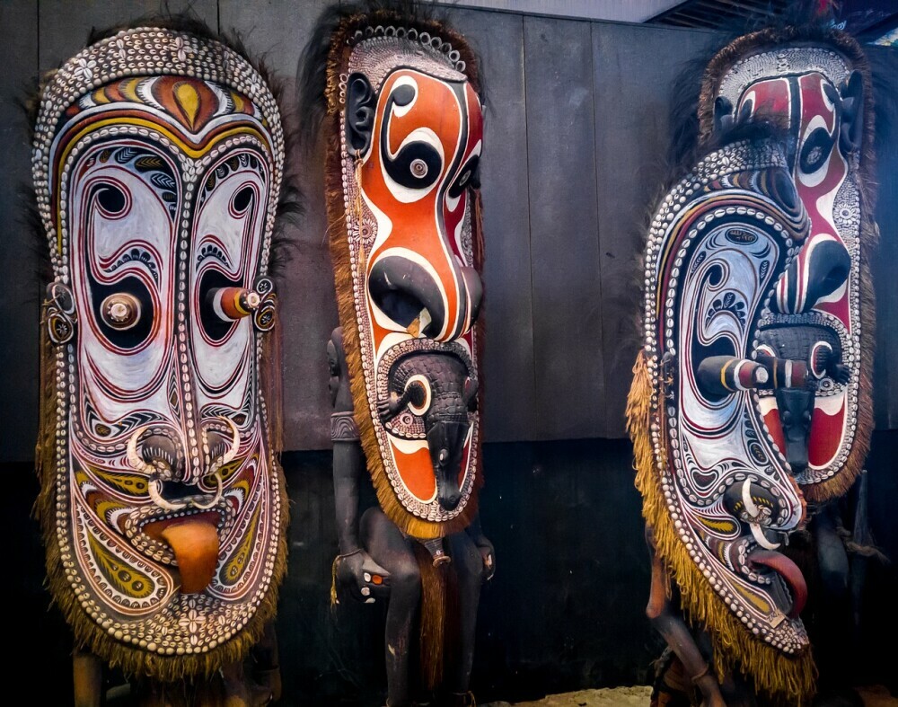 Image of traditional carvings of papua new guinea signifying the traditional and animistic beliefs of the people of papua new guinea dicovered when the early christian missionaries first made contacts in the early 1800s.
