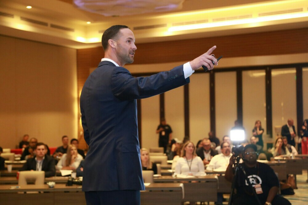 Image of a witness testifying in a courtroom.