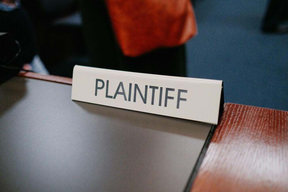 Image showing plaintiff name tag in the courtroom.