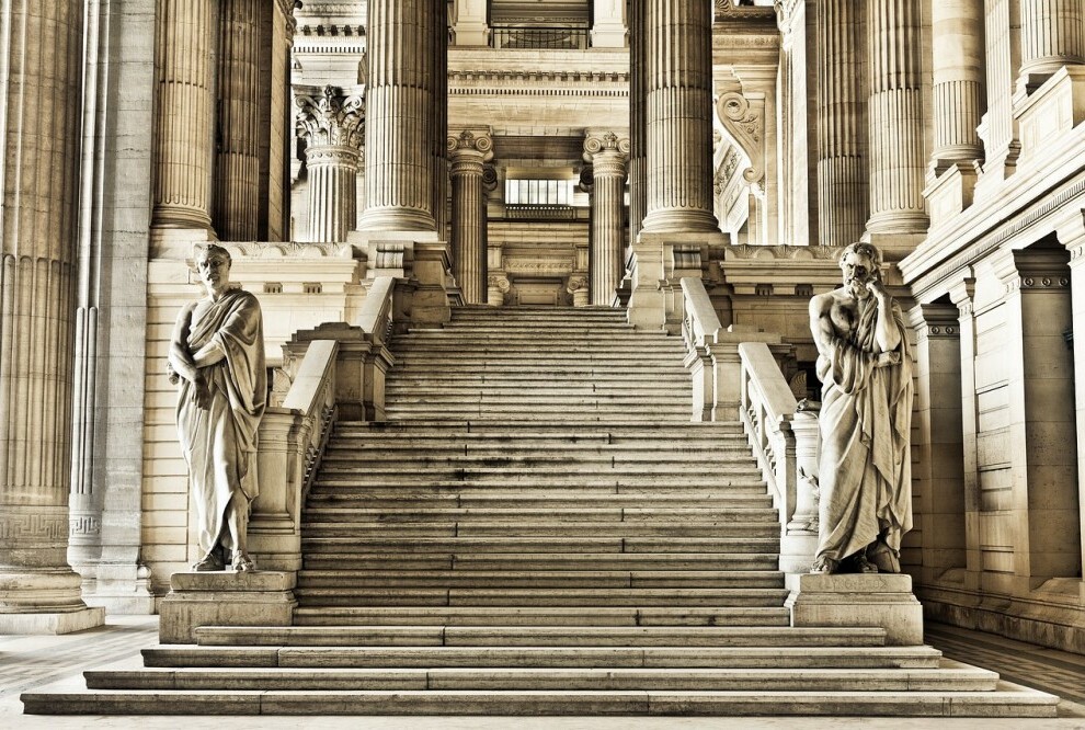 The image showing entrance to courthouse leading to courtroom.