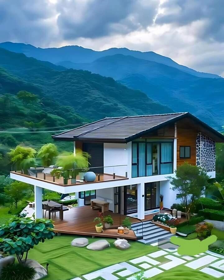 image of a very beautiful home with the blue ranges of tall mountain with thick rainforest in the background. - Purchasing A Home