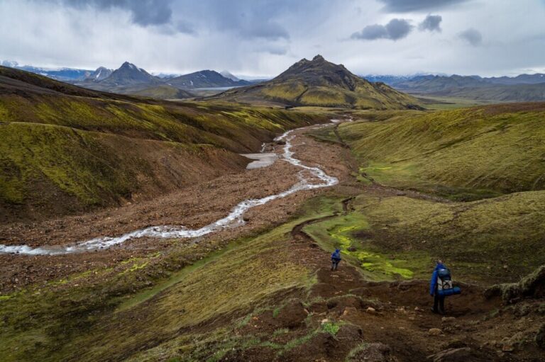 image of land with mountains in the background and a creek flowing through reflecting the traditional or customary land ownership in Papua New Guinea