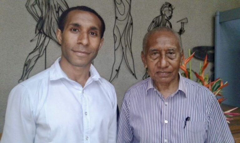 Sir Julius Chan, founding father of Papua New Guinea, during a parliamentary session. Picture of Sir Julius Chan and Dr Bal Kama standing after their meeting.