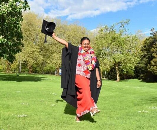 Theresa Philips standing proudly at Massey University in New Zealand – PNG youth scholarship success story -overcoming fear of failure